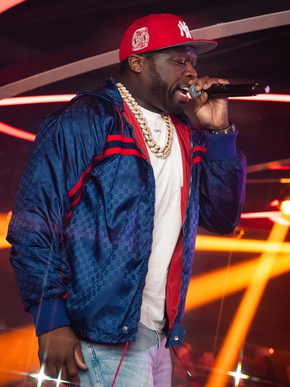 50 Cent performing on the Vendôme stage under red light